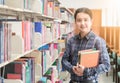 Portrait of young student smile and stand with book Royalty Free Stock Photo