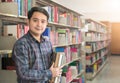 Portrait of young student smile and stand with book Royalty Free Stock Photo