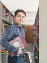 Portrait of young student smile and stand with book Royalty Free Stock Photo