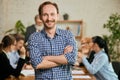 Portrait of young and successful businessman. Happy confident man looking at camera and smiling. Concept of business Royalty Free Stock Photo