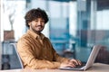 Portrait of young successful businessman inside office at workplace, hispanic smiling and looking at camera, male Royalty Free Stock Photo