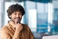 Portrait of young successful businessman inside office at workplace, hispanic smiling and looking at camera, male Royalty Free Stock Photo