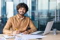 Portrait of young successful Indian businessman, man paper work smiling and looking at camera, joyful financier Royalty Free Stock Photo