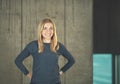 Portrait of casual businesswoman in front of a concrete wall Royalty Free Stock Photo