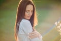 Portrait of young sunlit woman