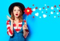 Woman with red pinwheel with hearts Royalty Free Stock Photo