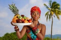 Portrait of a sweet Black Woman with a tray of fruit against the background of nature Royalty Free Stock Photo