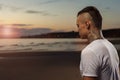 Portrait of young tattoo man meditating outdoors