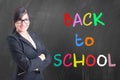Portrait of young teacher in front of blackboard Royalty Free Stock Photo