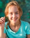 Portrait of Young Teen Girl with Beautiful Green Eyes Smiling and Looking into Camera Royalty Free Stock Photo