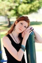 Portrait young teen girl outdoors leaning on pole Royalty Free Stock Photo