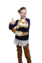 The portrait of young teenage girl with a toy dog in her hand onwhite background Royalty Free Stock Photo