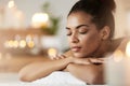 Portrait of tender african girl with closed eyes resting relaxing in spa resort. Royalty Free Stock Photo