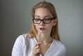 Portrait of the young thinking business woman looking down Royalty Free Stock Photo