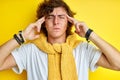 Portrait of young thinking curly man touching head Royalty Free Stock Photo