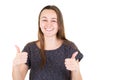 Portrait of young thumbs up woman looking in camera on white background