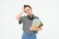 Portrait of young tired student, girl has headache, touching head with troubled face expression, sighing from Royalty Free Stock Photo