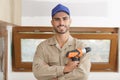 portrait young tradesman holding cordless drill Royalty Free Stock Photo