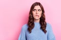 Portrait of young unsure woman bite lips nervous choosing best product looking mockup doubtful wear blue sweater