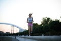 Urban fitness girl jogging outdoors in the evening Royalty Free Stock Photo