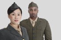 Portrait of young US military officers in uniform over gray background