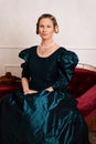 Portrait young victorian woman in green dress