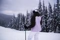Young woman athlete posing on skis on a mountain slope. professional sportsman is skiing. winter sport Royalty Free Stock Photo