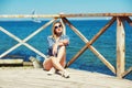 Stylish young woman in town . Girl dressed in jeans and a shirt Royalty Free Stock Photo