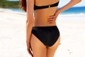 Portrait of young woman in bikini flaunting her buttocks Royalty Free Stock Photo