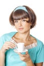 Portrait of young woman in blak dress enjoying a cup of coffee
