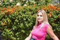 Portrait of young woman, blonde, green eyes, wearing pink t-shirt, looking at camera, pure, angelic, beautiful. Concept beauty, Royalty Free Stock Photo