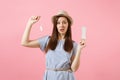 Portrait of young woman in blue dress holding sanitary napkin, tampon for variant safety menstruation days isolated on Royalty Free Stock Photo