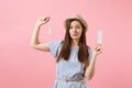 Portrait of young woman in blue dress holding sanitary napkin, tampon for variant safety menstruation days isolated on Royalty Free Stock Photo