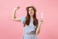 Portrait of young woman in blue dress holding sanitary napkin, tampon for variant safety menstruation days isolated on Royalty Free Stock Photo