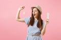 Portrait of young woman in blue dress holding sanitary napkin, tampon for variant safety menstruation days isolated on Royalty Free Stock Photo