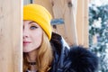 Portrait of young woman with blue eyes and blond hair on the snowy street of city Royalty Free Stock Photo