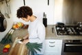 Young woman chopping vegetables in kitchen Royalty Free Stock Photo