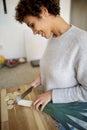 Young woman chopping vegetables in kitchen at home Royalty Free Stock Photo