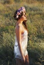 Portrait of young woman with circlet of flowers on head Royalty Free Stock Photo