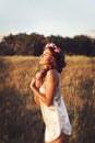 Portrait of young woman with circlet of flowers on head Royalty Free Stock Photo