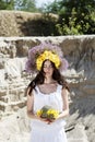 Portrait of young woman with circlet of flowers on head Royalty Free Stock Photo