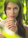 Portrait of young woman in corn field with drinking glass Royalty Free Stock Photo