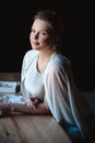 Portrait of woman, creating wedding jewelry, workplace of decorator. Woman`s hands in a process of creation