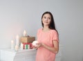 Portrait of a young woman with a decorative candle .photo with copy space