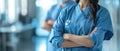 Portrait of young woman doctor with white coat standing in hospital Royalty Free Stock Photo