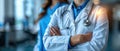 Portrait of young woman doctor with white coat standing in hospital Royalty Free Stock Photo