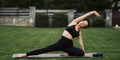 Portrait of a young woman doing yoga in the garden for exercise. Fitness and healthy lifestyle concept. Asian women doing yoga in Royalty Free Stock Photo