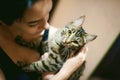 Young woman dressed T-shirt with a cat Royalty Free Stock Photo