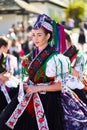 Portrait of a young woman dressed in a traditional folk costume in Holloko village, Hungary