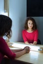 Portrait of a young girl in a dressing room looking closely at the mirror in her reflection Royalty Free Stock Photo